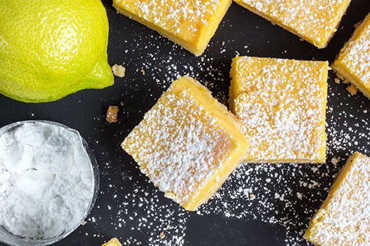 Olive oil lemon bars with sea salt and powdered sugar, made with D'Olivo Lemon Fused Olive Oil